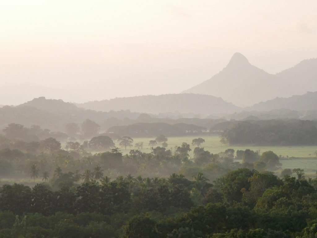 green hills and dusty views early in the morning before sunrise in Sri Lanka from a hot-air balloon