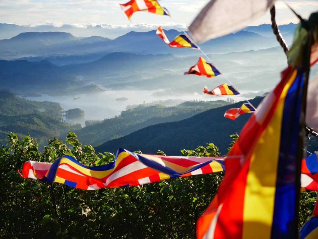 flags on the way down of adams peak sri lanka landscape