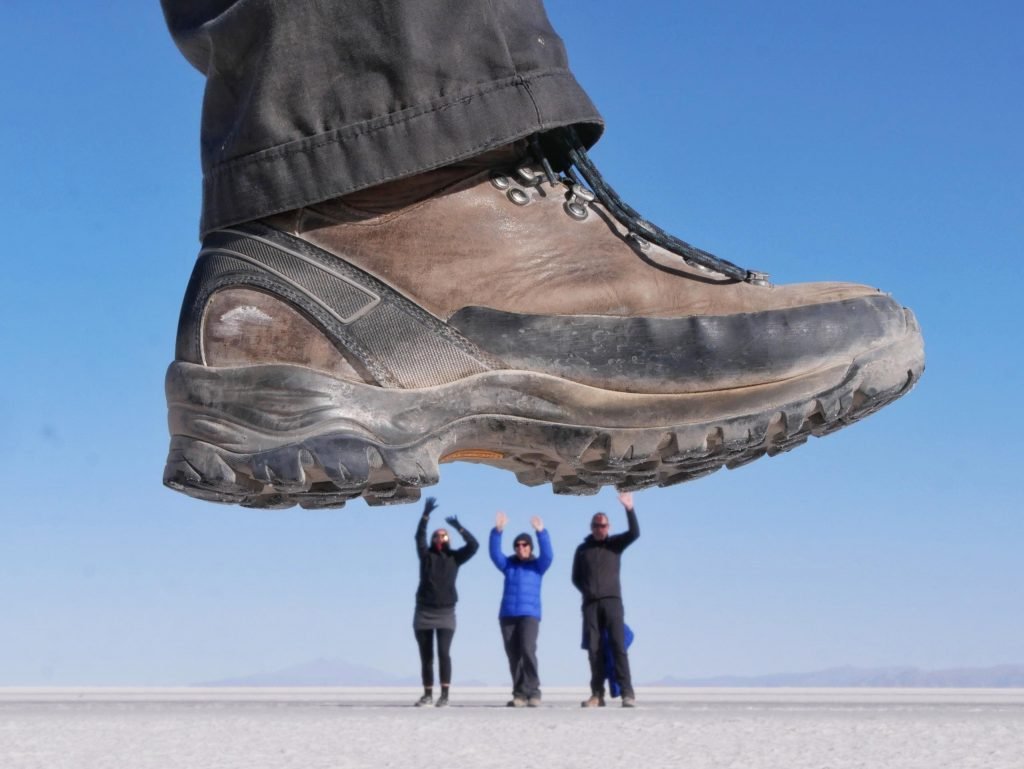 fun picture in uyuni salt flats, Bolivia, shoe trumpling on people