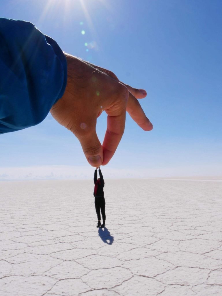 Hand holding girl in in uyuni salt flats, Bolivia