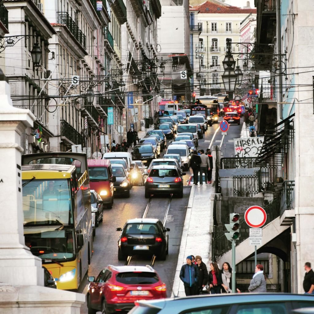 traffic jam in Lisbon Portugal with a lot of lights on a hill