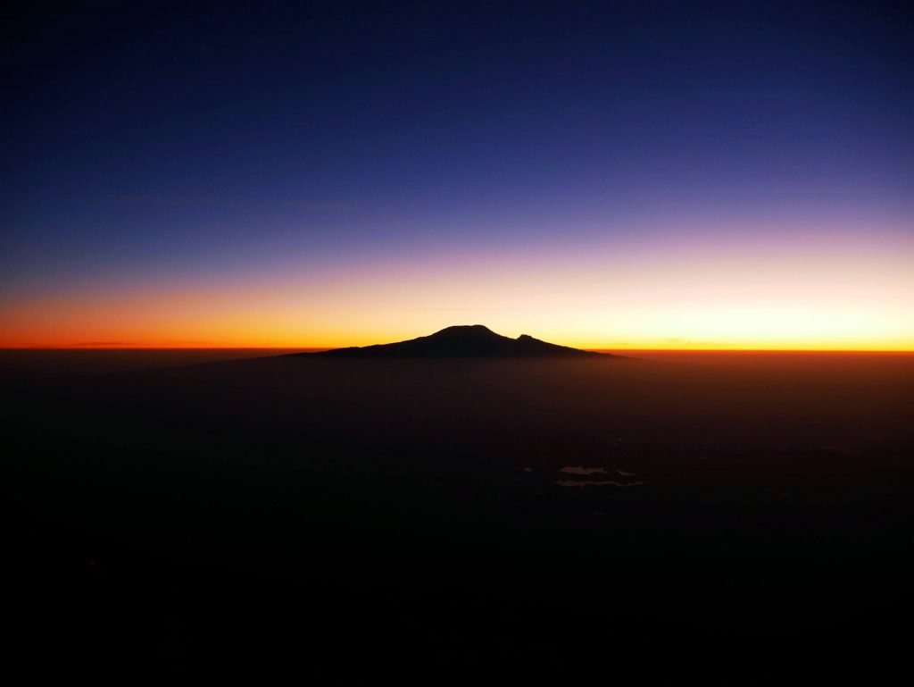 Sunset over Kilimandscharo from Mount Meru