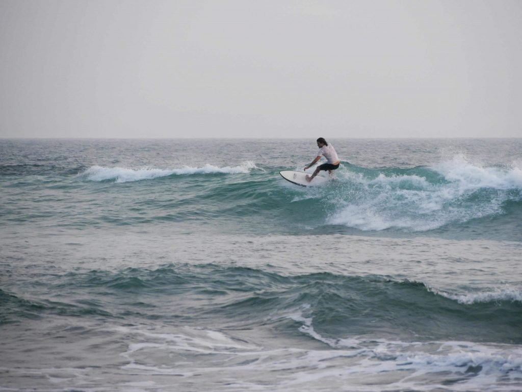 Surfer at Dalawella Beach, Unawatuna, Sri Lanka