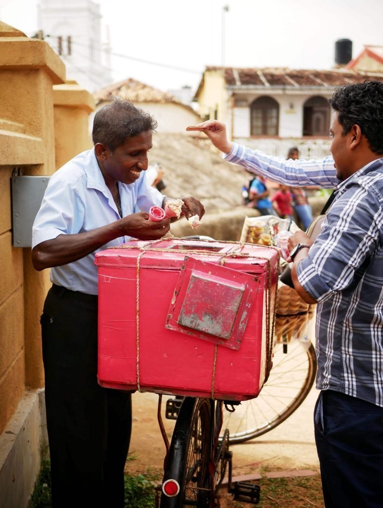 man selling ice cream at Galle Fort out of a bicycle in Sri Lanka