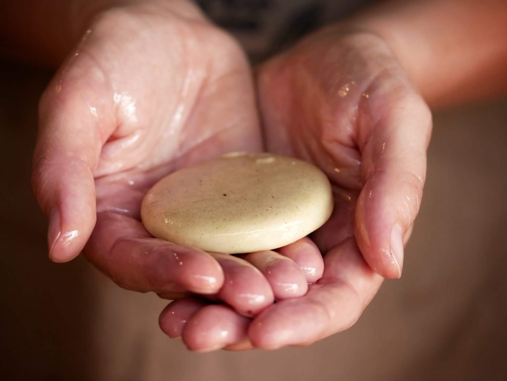 cocoa butter melting in a hand