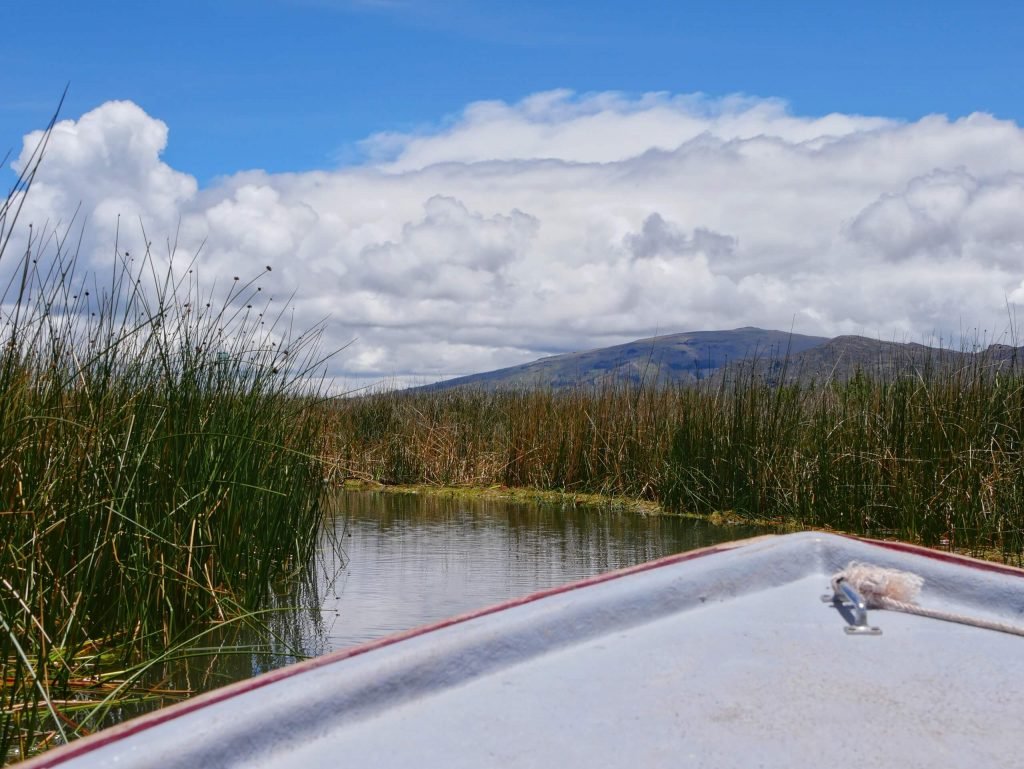 A boat in between Totora reed on Lake Titticaca