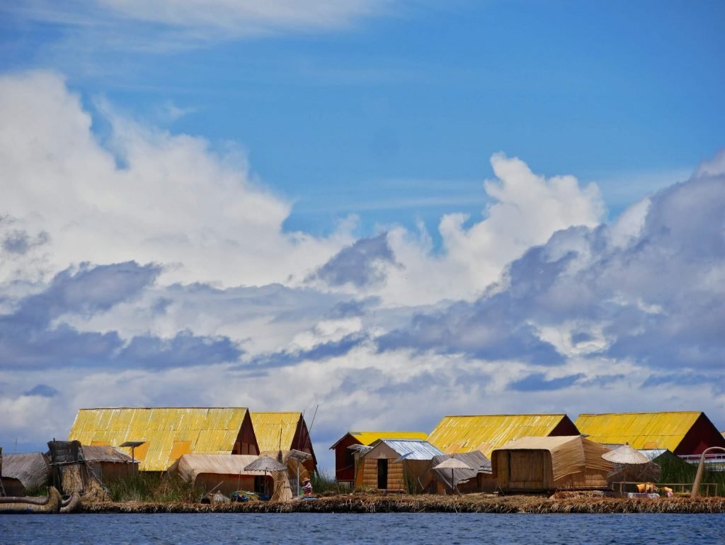 Yellow Uros houses on Lake Titticaca