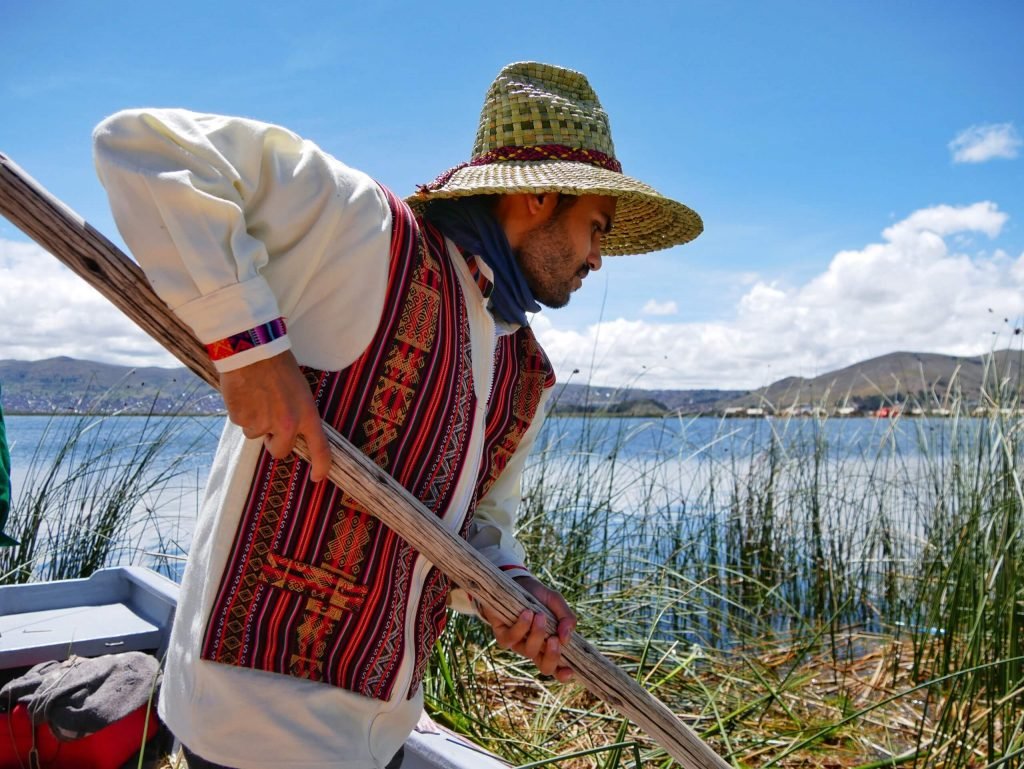 A man harvesting Totora reed on Lake Titticaca