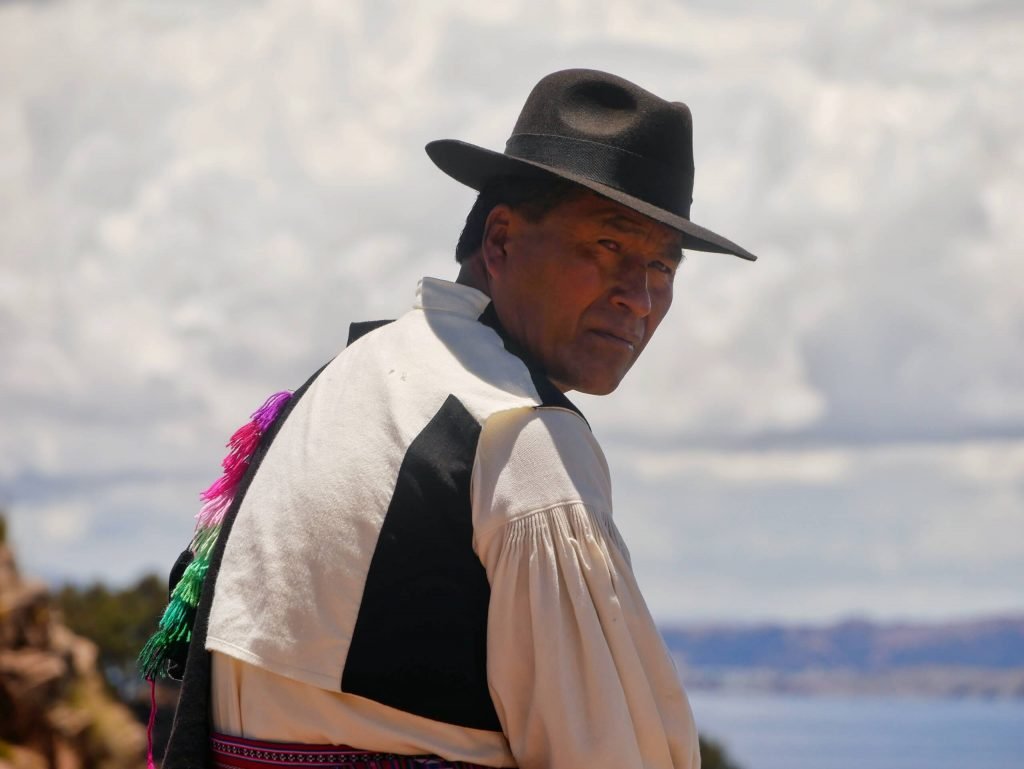A Taquileño man on Taquile island looking into the camera