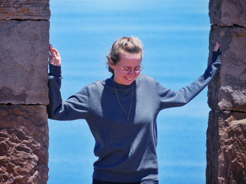 Britta Wiebe standing in an arch on Taquile island