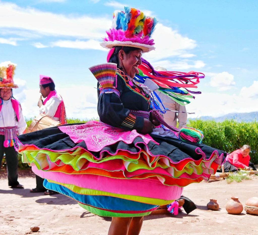 A Taquileño dancer woman with colorful skirts on Taquile island