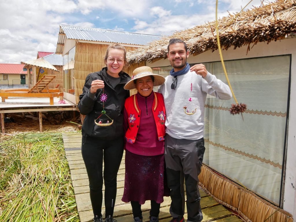 A couple and an uros women at Lake Titticaca