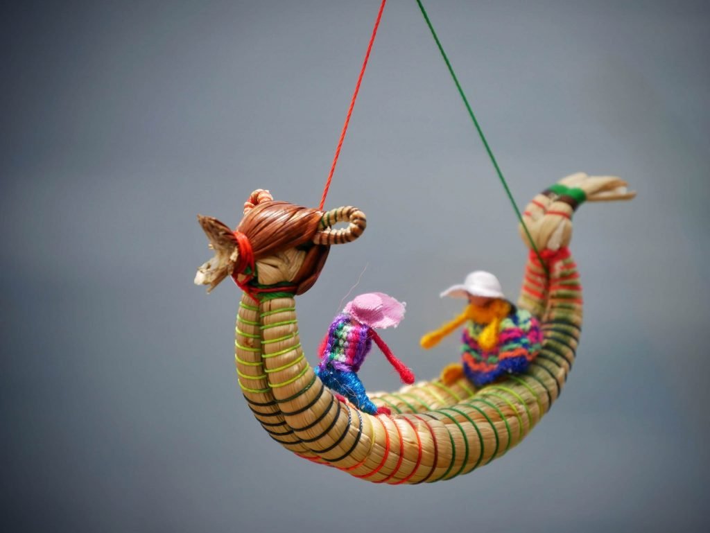 A boat with a Puma head made out of reed at Lake Titticaca, Peru