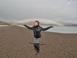 Britta Wiebe girl standing under rainbow Patagonia
