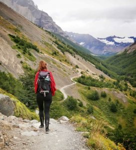 girl hiking trail torres del paine