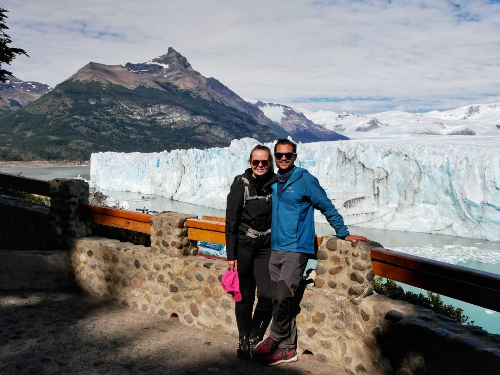 couple standing at mirador perito moreno glacier