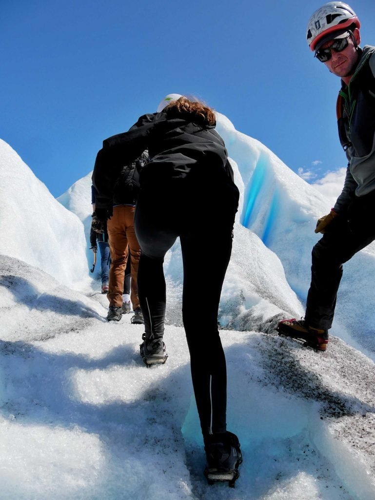 girl climbing glacier