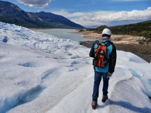 man walking on perito moreno