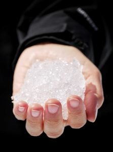 hand holds glacial ice