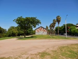 House with graffiti between palms in colonia del sacramento uruguay