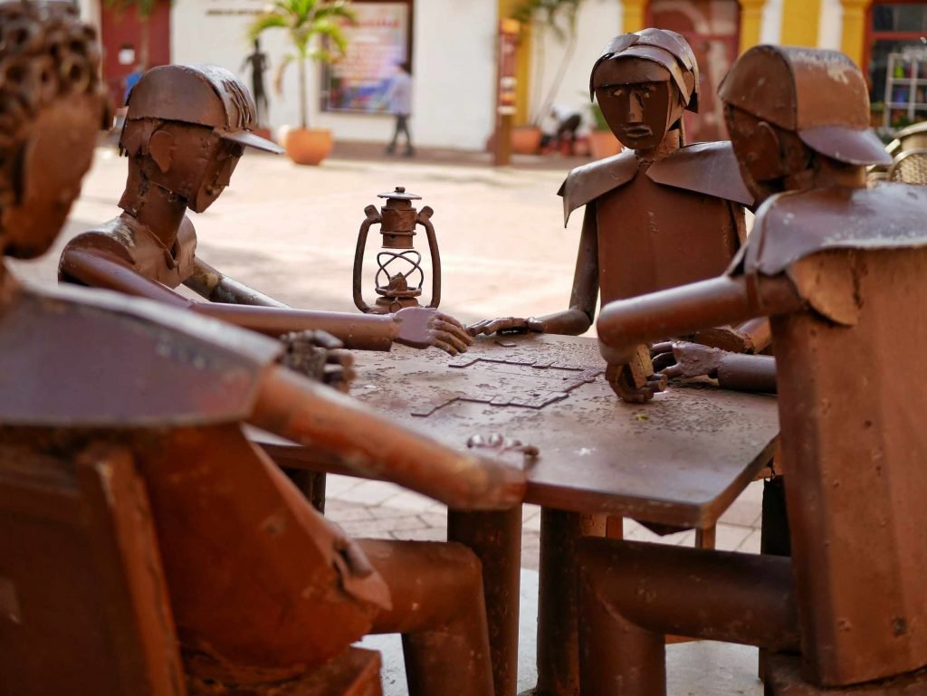 metal statues play board games in Cartagena Colombia