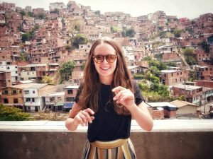 Britta Wiebe standing on hills in Medellin